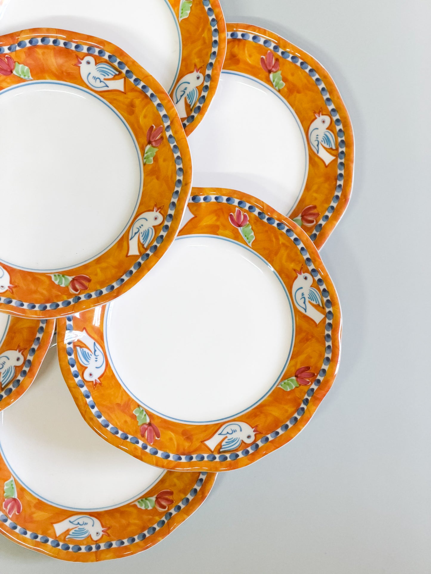 Juego de 8 platos naranjas pájaros