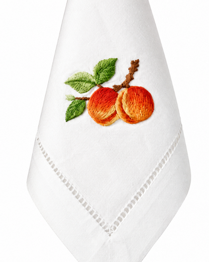 Servilleta de lino con bordado de durazno.