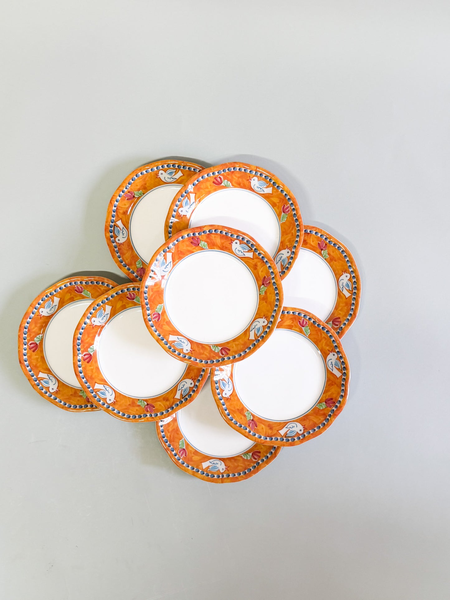 Juego de 8 platos naranjas pájaros